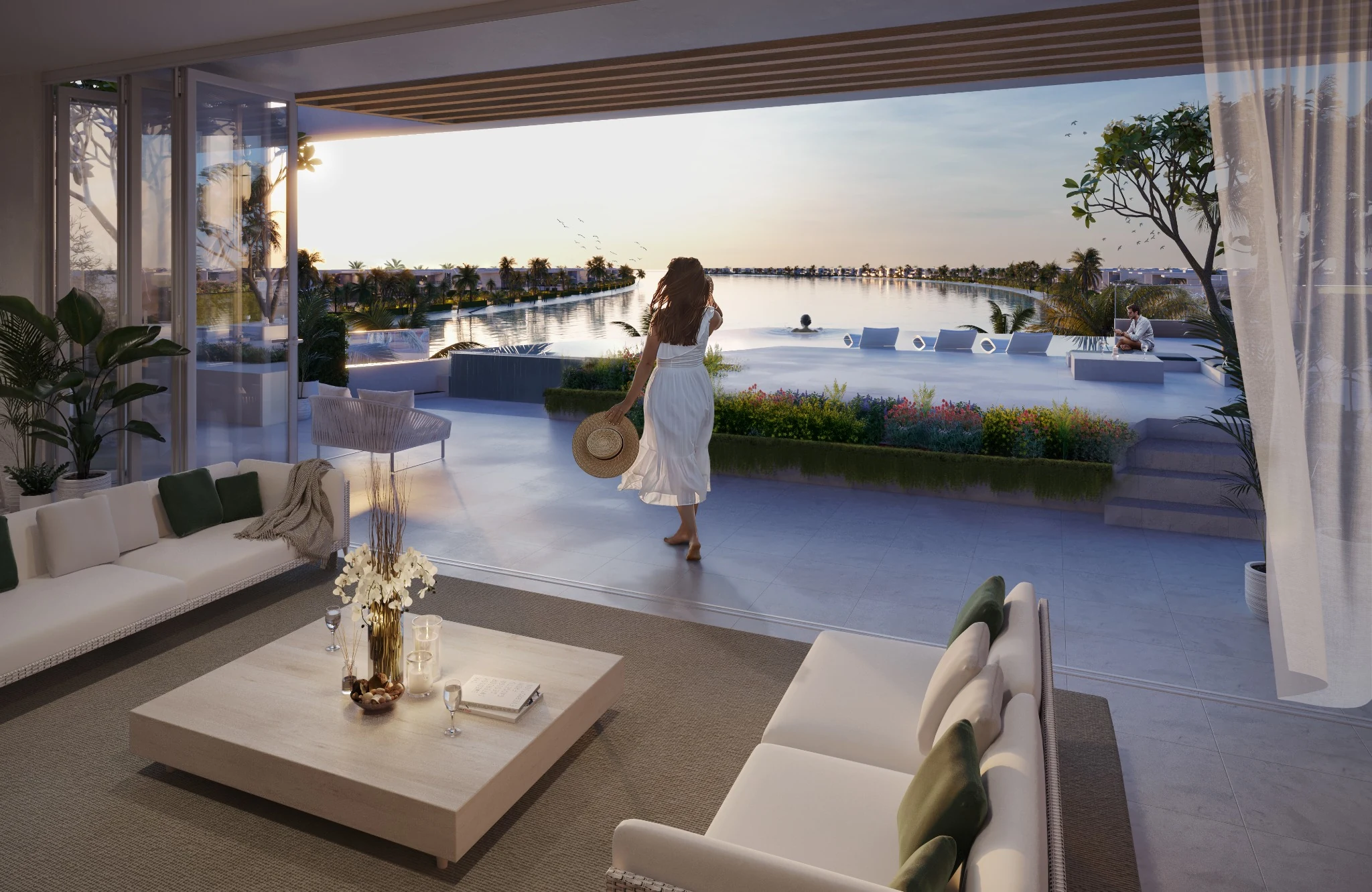 Waterfront living room opening toward an infinity pool